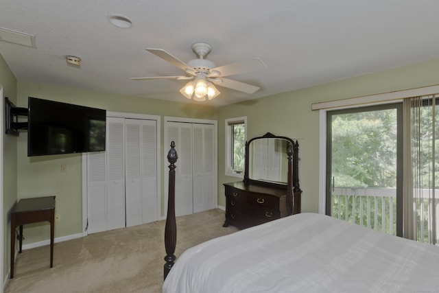 94 The Laurels Unit 94, Enfield, CT 06082 - bedroom featuring multiple windows, light colored carpet, multiple closets, and ceiling fan