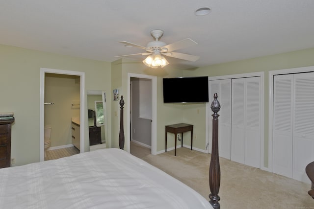 94 The Laurels Unit 94, Enfield, CT 06082 - bedroom with multiple closets, ensuite bath, carpet flooring, and a ceiling fan
