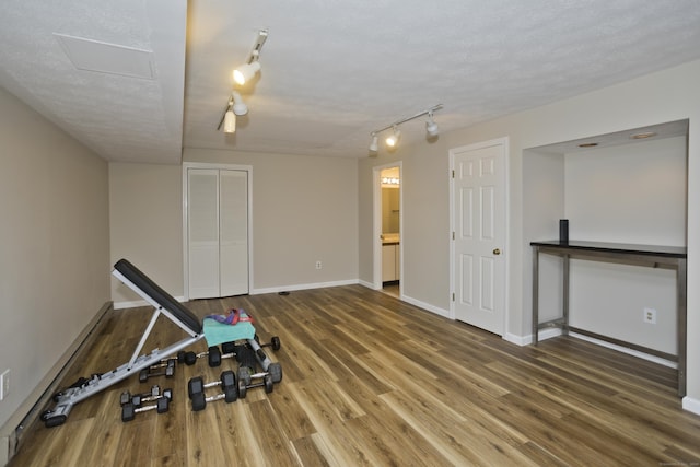 94 The Laurels Unit 94, Enfield, CT 06082 - exercise room with rail lighting and wood finished floors