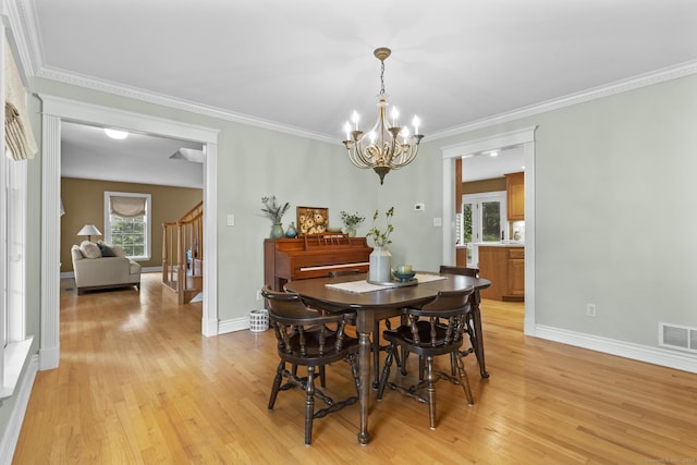 72 Hazelwood Dr, Southington, CT 06489 - dining room with a chandelier, light wood-type flooring, stairs, and ornamental molding