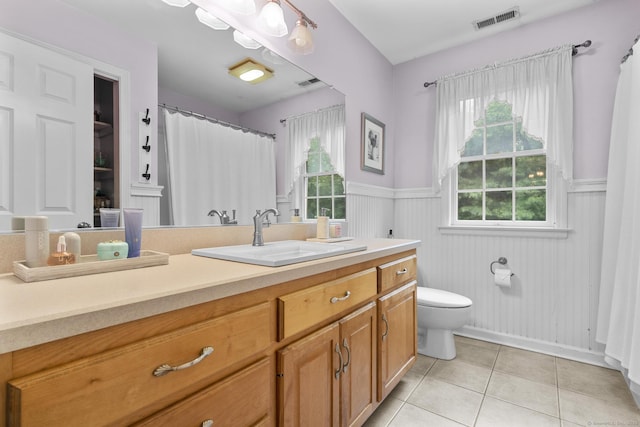72 Hazelwood Dr, Southington, CT 06489 - bathroom featuring wainscoting, vanity, tile patterned floors, plenty of natural light, and curtained shower