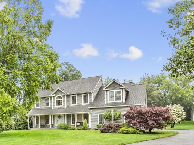 72 Hazelwood Dr, Southington, CT 06489 - colonial inspired home featuring covered porch, a front yard, and a shingled roof