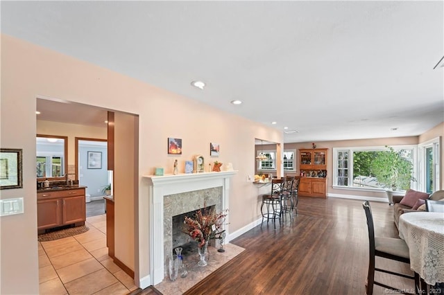 23 Sunset Hill Rd, Brookfield, CT 06804 - living area featuring a high end fireplace, recessed lighting, and light wood-type flooring
