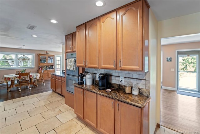 23 Sunset Hill Rd, Brookfield, CT 06804 - kitchen featuring stainless steel double oven, dark stone counters, backsplash, recessed lighting, and light tile patterned flooring