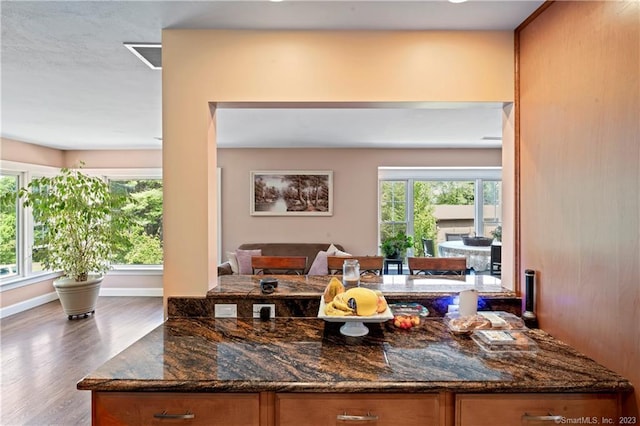 23 Sunset Hill Rd, Brookfield, CT 06804 - kitchen with brown cabinetry, open floor plan, wood finished floors, and dark stone counters