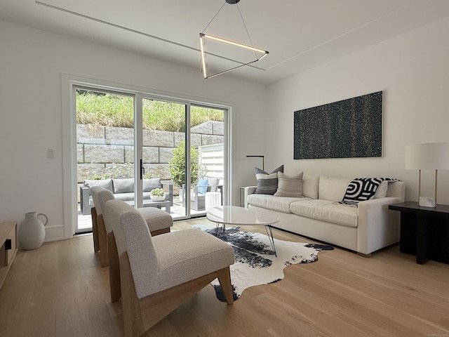 785 Post Rd E Unit 202, Westport, CT 06880 - living room featuring light wood-style floors and a chandelier