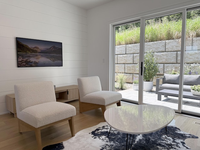 785 Post Rd E Unit 202, Westport, CT 06880 - living area featuring wood finished floors and wood walls
