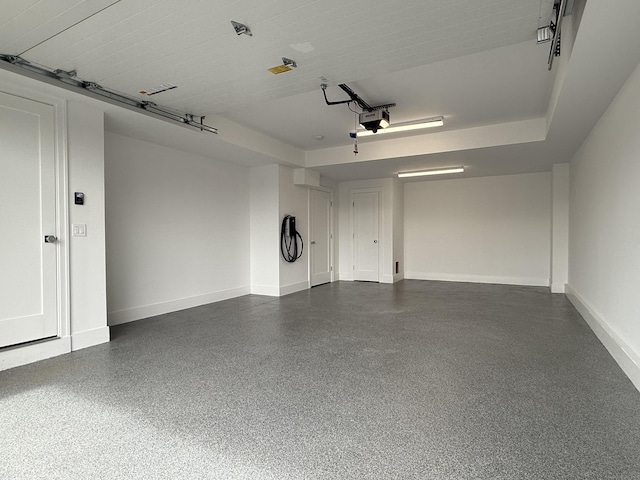 785 Post Rd E Unit 202, Westport, CT 06880 - garage with a garage door opener and baseboards