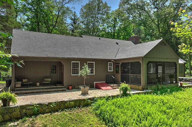 50 Pond Rd, Easton, CT 06612 - back of house with a sunroom, a chimney, and roof with shingles