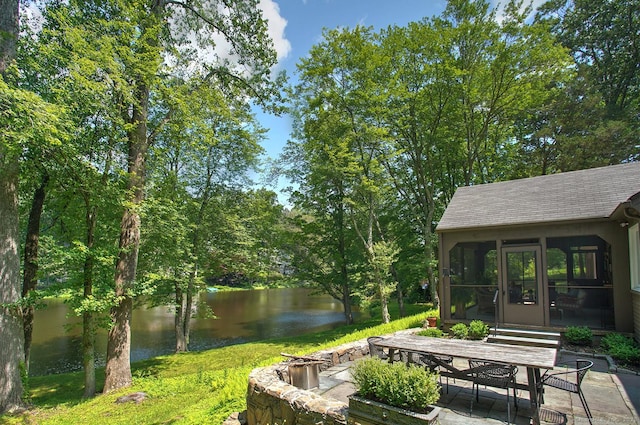 50 Pond Rd, Easton, CT 06612 - view of patio featuring a water view, a sunroom, a fire pit, and outdoor dining space