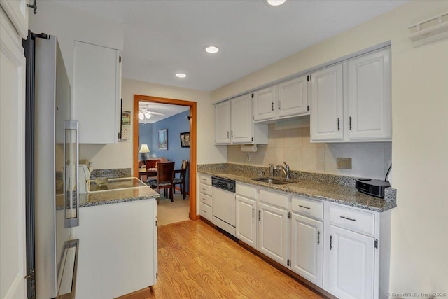 170 Summer St Unit 170, Portland, CT 06480 - kitchen with white dishwasher, recessed lighting, white cabinetry, light wood-style floors, and stone counters