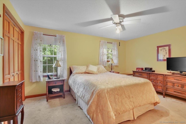 170 Summer St Unit 170, Portland, CT 06480 - bedroom with light carpet, multiple windows, a ceiling fan, and a closet