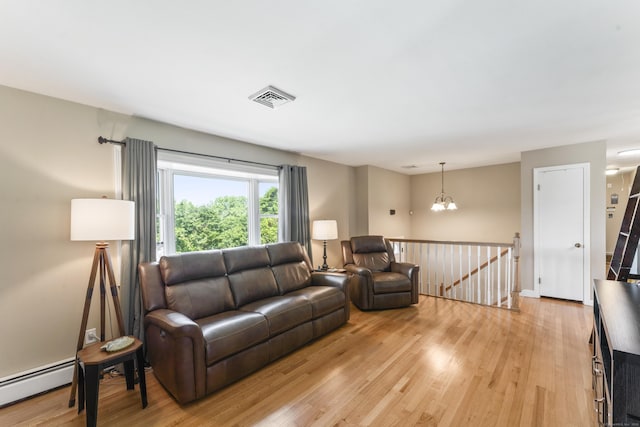 17 Stony Brook Rd, Brookfield, CT 06804 - living area featuring baseboard heating, light wood-type flooring, and a chandelier