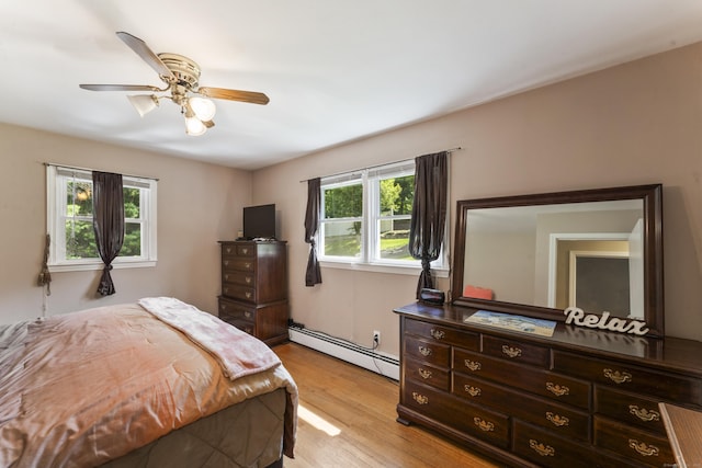 17 Stony Brook Rd, Brookfield, CT 06804 - bedroom featuring a baseboard radiator, multiple windows, light wood-type flooring, and a ceiling fan