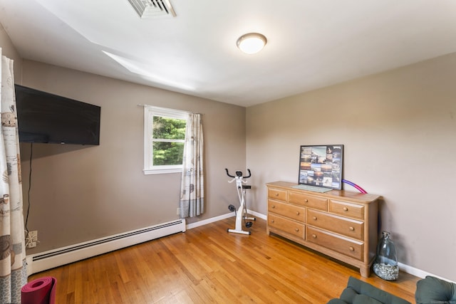 17 Stony Brook Rd, Brookfield, CT 06804 - exercise room with a baseboard radiator and light wood-style flooring