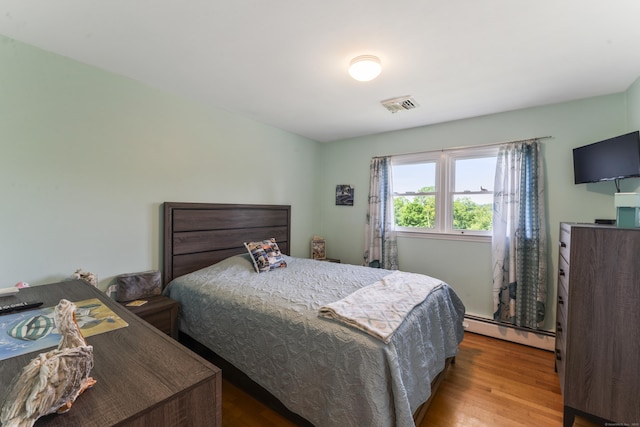 17 Stony Brook Rd, Brookfield, CT 06804 - bedroom featuring a baseboard heating unit and wood finished floors