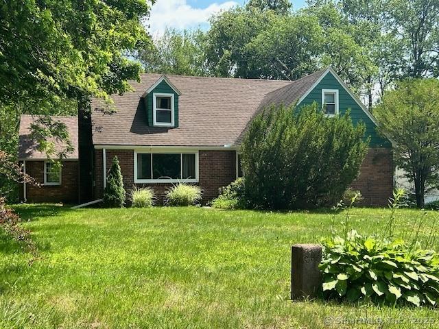 70 Tunxis Ave, Bloomfield, CT 06002 - new england style home featuring brick siding and a front lawn