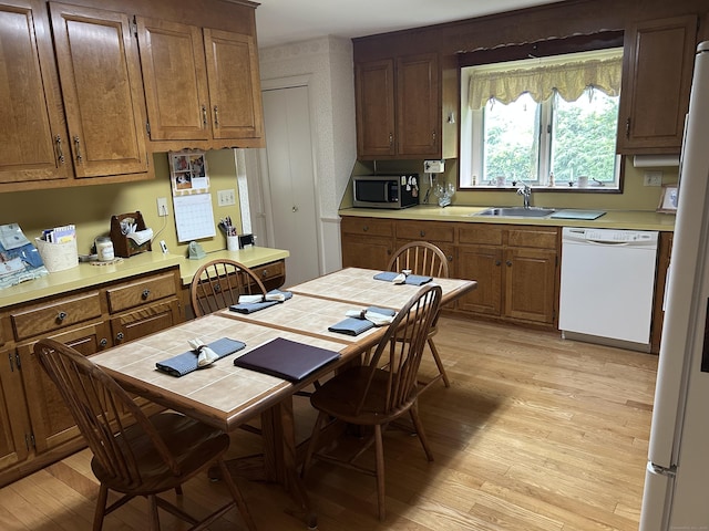 16 Round Hill Cir, Naugatuck, CT 06770 - kitchen featuring white appliances, light wood-type flooring, and light countertops
