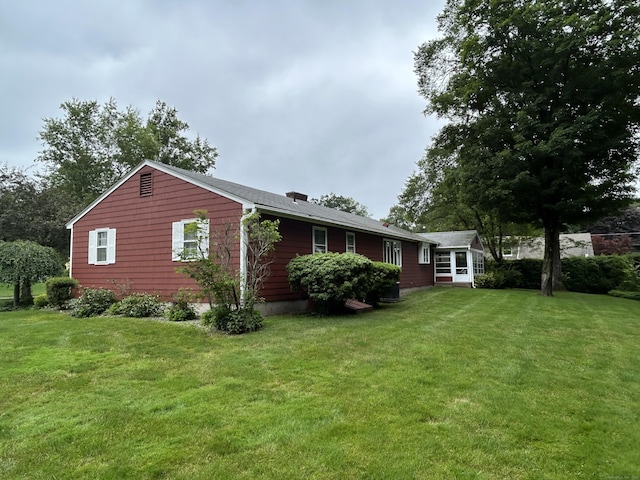 16 Round Hill Cir, Naugatuck, CT 06770 - rear view of property with a yard and a chimney