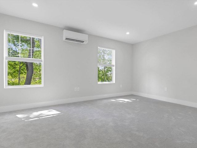 138 Boston Post Rd Unit 15, East Lyme, CT 06333 - carpeted empty room featuring a wall mounted air conditioner, plenty of natural light, and recessed lighting