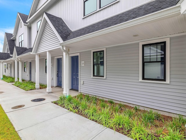138 Boston Post Rd Unit 15, East Lyme, CT 06333 - entrance to property featuring board and batten siding, a porch, and roof with shingles