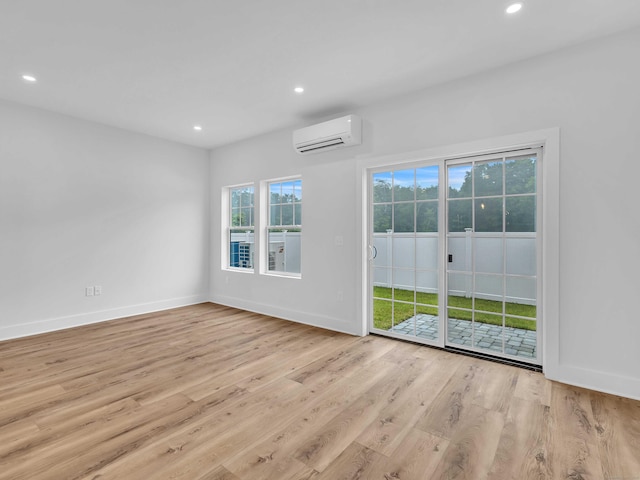 138 Boston Post Rd Unit 15, East Lyme, CT 06333 - spare room featuring a wall unit AC, recessed lighting, and wood finished floors
