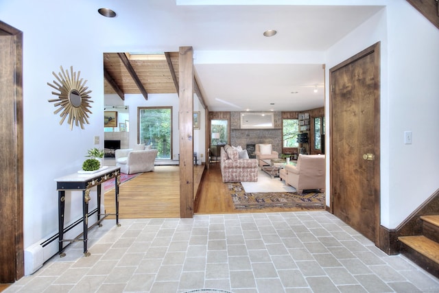 174 Cross Hwy, Westport, CT 06880 - living area featuring a fireplace, baseboard heating, beamed ceiling, healthy amount of natural light, and recessed lighting