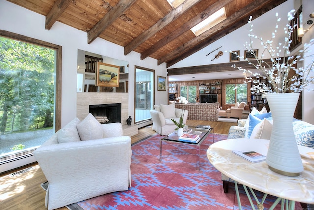174 Cross Hwy, Westport, CT 06880 - living area with a tile fireplace, wood finished floors, high vaulted ceiling, a baseboard heating unit, and a wood ceiling with exposed beams