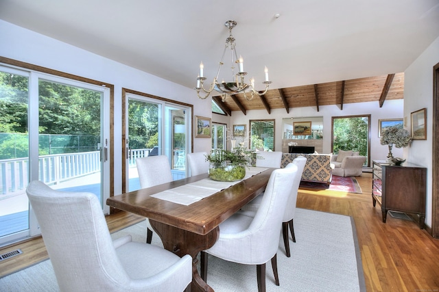 174 Cross Hwy, Westport, CT 06880 - dining area featuring a chandelier, plenty of natural light, wood finished floors, and wood ceiling