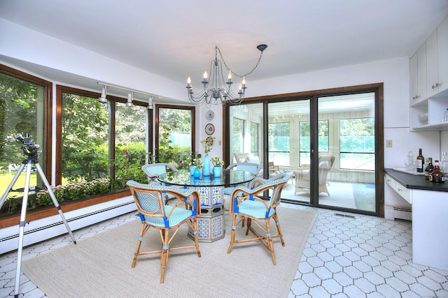 174 Cross Hwy, Westport, CT 06880 - dining space featuring a chandelier, plenty of natural light, and a baseboard radiator
