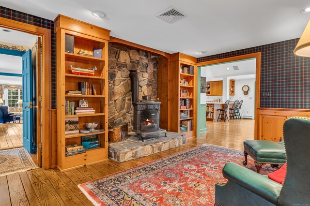604 W Lake Ave, Guilford, CT 06437 - living room with hardwood / wood-style floors, a wood stove, and recessed lighting