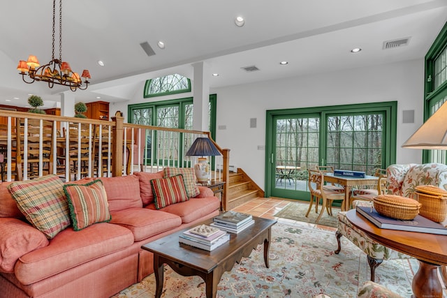604 W Lake Ave, Guilford, CT 06437 - living room with a chandelier, recessed lighting, plenty of natural light, a baseboard radiator, and stairway