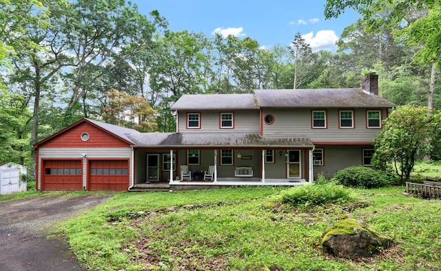79 Ledgewood Dr, North Branford, CT 06471 - view of front of property with an attached garage, a chimney, driveway, a porch, and a shed