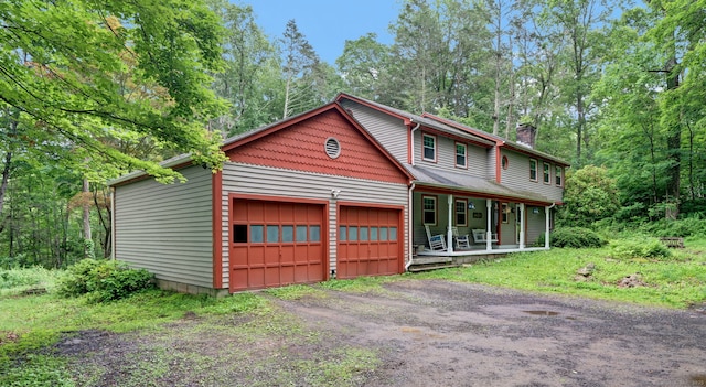 79 Ledgewood Dr, North Branford, CT 06471 - view of front facade featuring a porch, a chimney, and dirt driveway