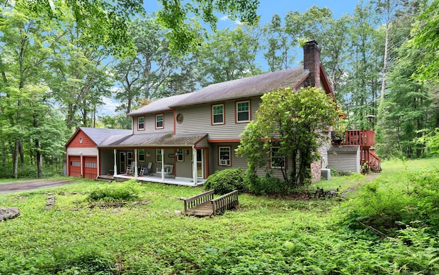 79 Ledgewood Dr, North Branford, CT 06471 - view of front of property featuring a porch, a chimney, asphalt driveway, an attached garage, and a shingled roof