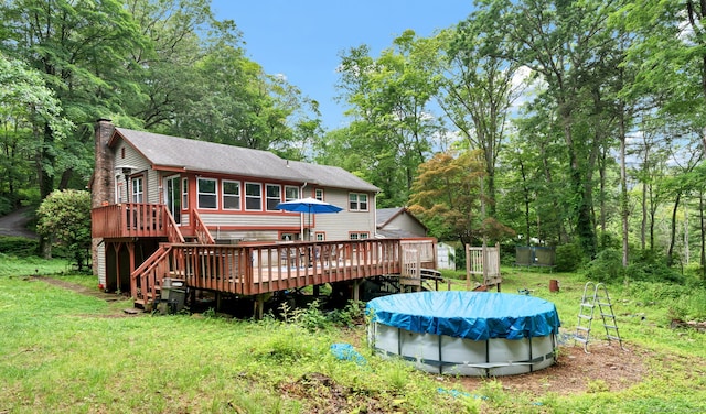 79 Ledgewood Dr, North Branford, CT 06471 - rear view of house with a deck, stairs, a chimney, a covered pool, and roof with shingles