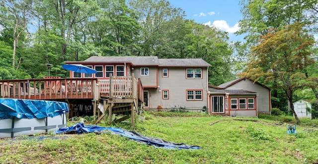 79 Ledgewood Dr, North Branford, CT 06471 - back of house with a deck, a shed, a lawn, and stairs