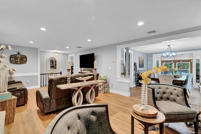 79 Ledgewood Dr, North Branford, CT 06471 - living area featuring a chandelier, recessed lighting, light wood-style flooring, and wainscoting