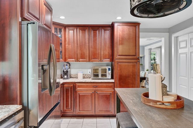 79 Ledgewood Dr, North Branford, CT 06471 - kitchen featuring stainless steel refrigerator with ice dispenser, glass insert cabinets, light stone countertops, light tile patterned floors, and recessed lighting