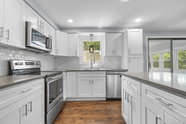 32 Cullen Ave, West Haven, CT 06516 - kitchen with stainless steel appliances, dark wood-style floors, white cabinets, backsplash, and recessed lighting