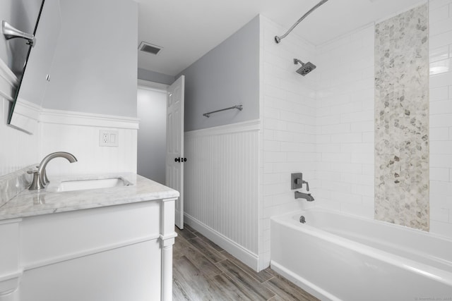 32 Cullen Ave, West Haven, CT 06516 - bathroom with wood finished floors, shower / washtub combination, vanity, and a wainscoted wall