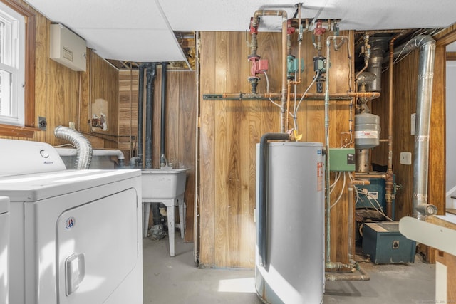 32 Cullen Ave, West Haven, CT 06516 - unfinished below grade area featuring water heater, wood walls, and independent washer and dryer