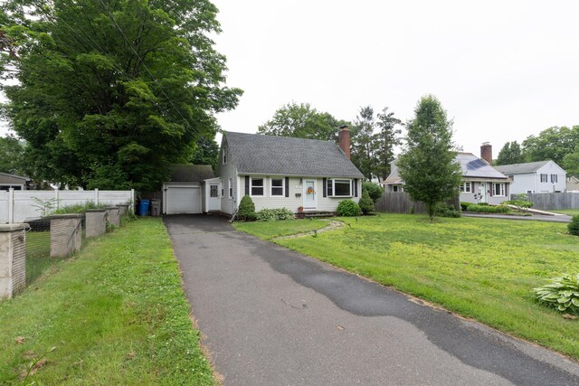 180 Lake Ave, Bristol, CT 06010 - cape cod house featuring asphalt driveway and a chimney