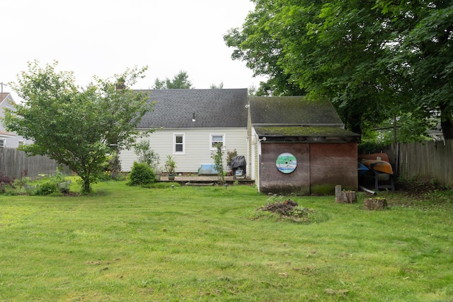 180 Lake Ave, Bristol, CT 06010 - back of house featuring roof with shingles