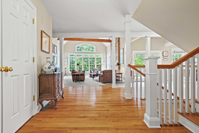 95 Shailer Pond Rd, Deep River, CT 06417 - hallway with light wood-style flooring, decorative columns, and vaulted ceiling