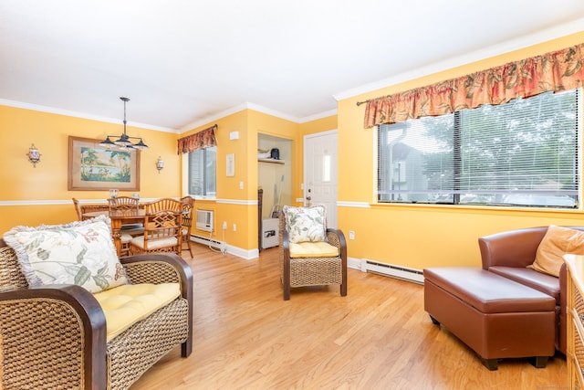 85 N Main St Unit 96, East Hampton, CT 06424 - living area featuring a baseboard heating unit, a baseboard radiator, light wood-style floors, and crown molding