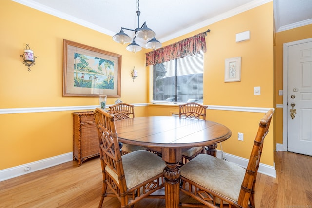 85 N Main St Unit 96, East Hampton, CT 06424 - dining space featuring crown molding, light wood finished floors, and a chandelier