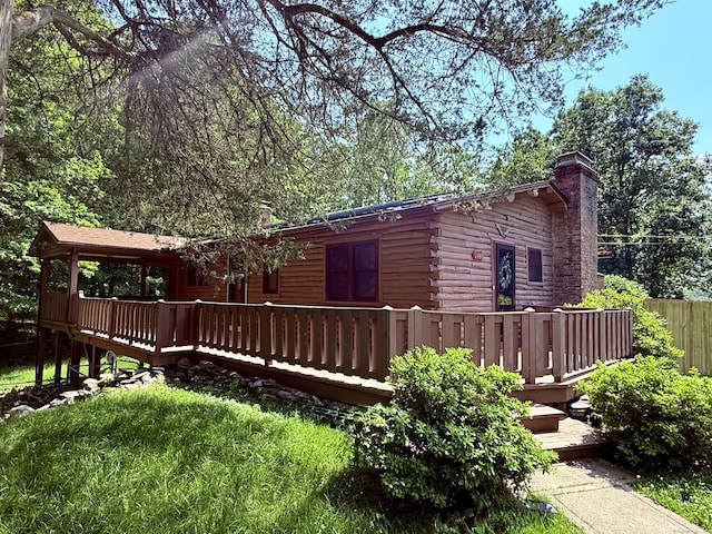 3951 S St, Coventry, CT 06238 - rear view of property featuring a deck, log siding, and a chimney