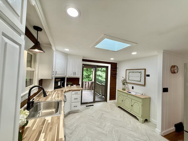 3951 S St, Coventry, CT 06238 - kitchen with a skylight, white cabinetry, green cabinets, recessed lighting, and butcher block counters