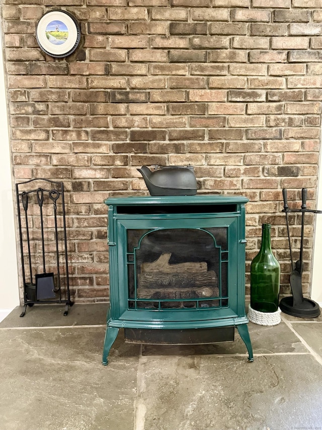3951 S St, Coventry, CT 06238 - detailed view of a wood stove and unfinished concrete floors